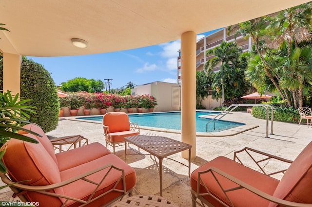 view of swimming pool with a patio