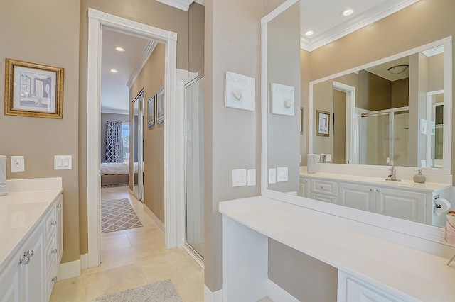 bathroom featuring tile patterned floors, walk in shower, crown molding, and vanity