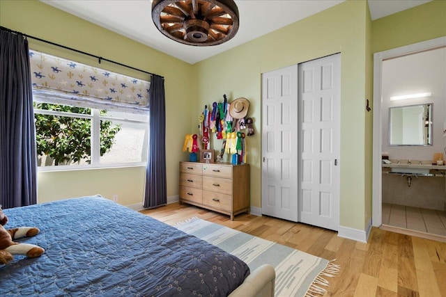 bedroom with ceiling fan and light hardwood / wood-style floors