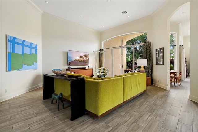 living room featuring crown molding and hardwood / wood-style flooring