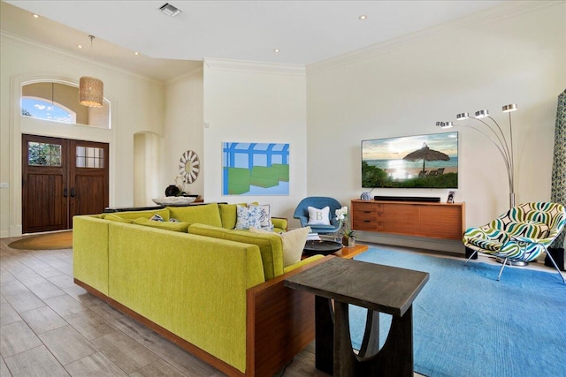 living room with ornamental molding and wood-type flooring