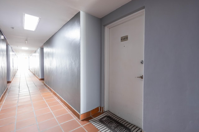 hallway featuring light tile floors