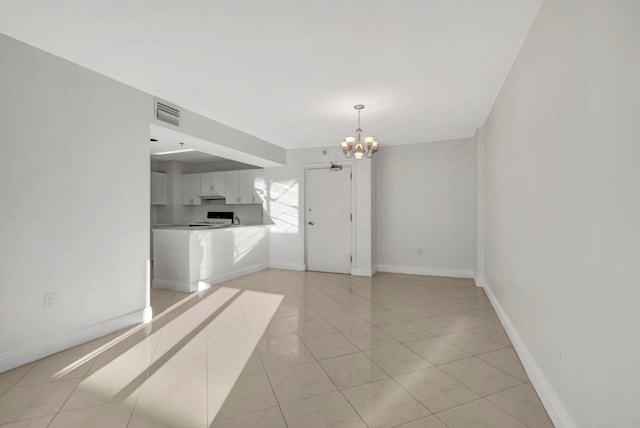 interior space featuring a chandelier and light tile floors