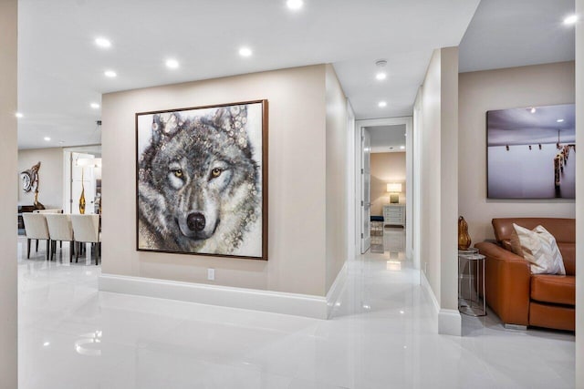 hallway featuring light tile floors