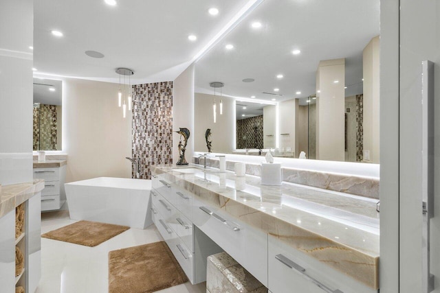 bathroom featuring independent shower and bath, vanity, and tile floors