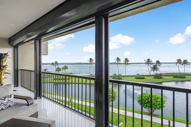 balcony featuring a water view