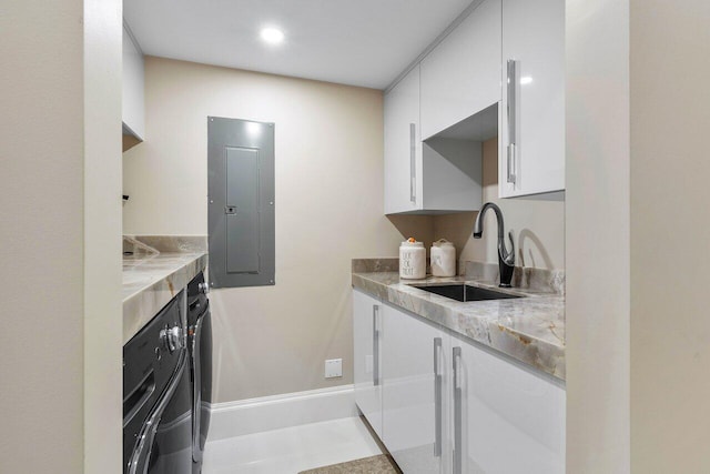 kitchen with oven, sink, and white cabinets