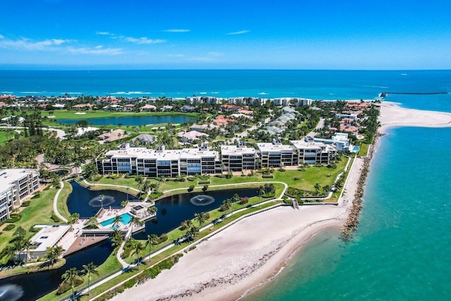 bird's eye view featuring a view of the beach and a water view