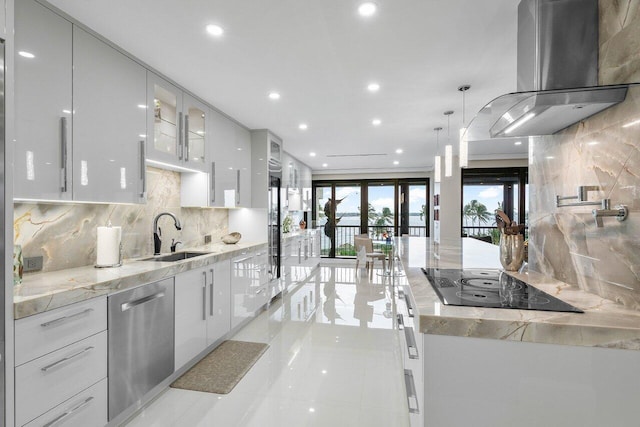 kitchen featuring stainless steel dishwasher, wall chimney exhaust hood, pendant lighting, sink, and tasteful backsplash