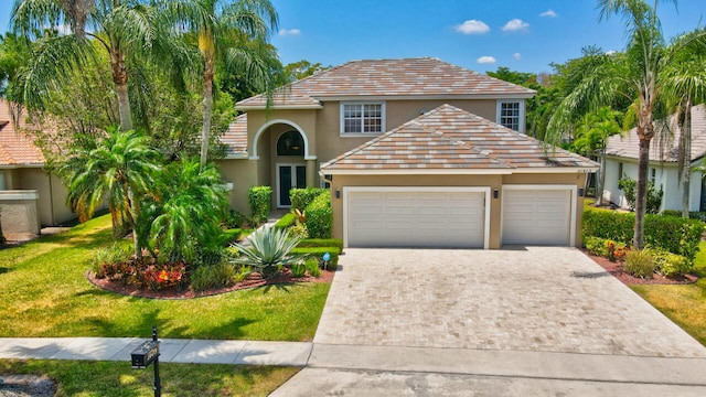 view of front facade featuring a garage and a front yard