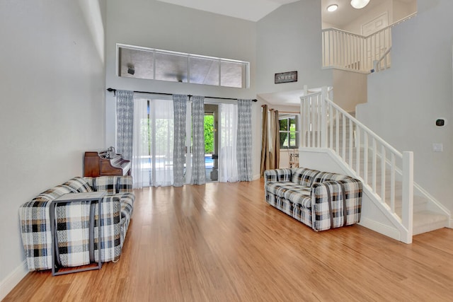 entrance foyer featuring a high ceiling and light wood-type flooring