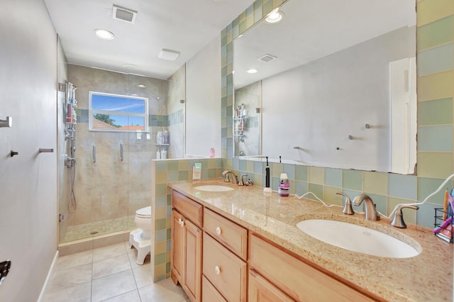 bathroom with tile flooring, a shower with shower door, dual bowl vanity, backsplash, and toilet