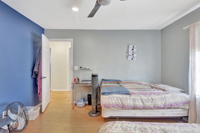 bedroom featuring ceiling fan and wood-type flooring