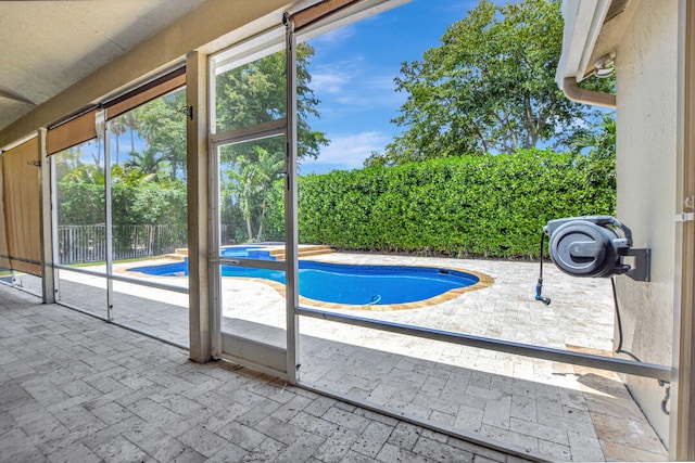 view of swimming pool featuring a patio area