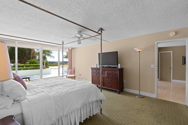 bedroom featuring a textured ceiling, carpet, ceiling fan, and access to exterior