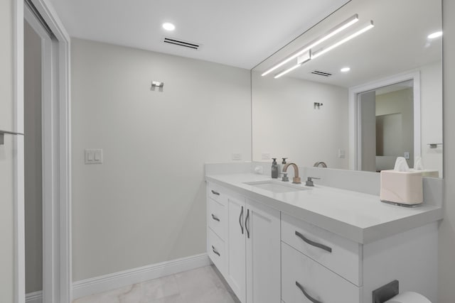 bathroom featuring tile floors and vanity