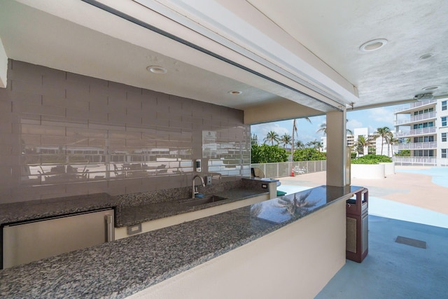 view of terrace with sink and a balcony