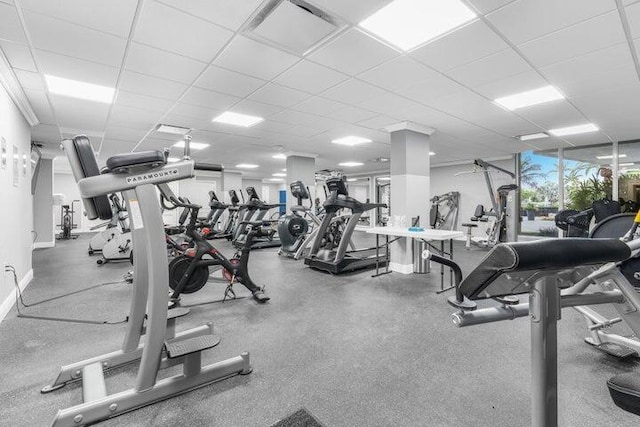 workout area with a paneled ceiling