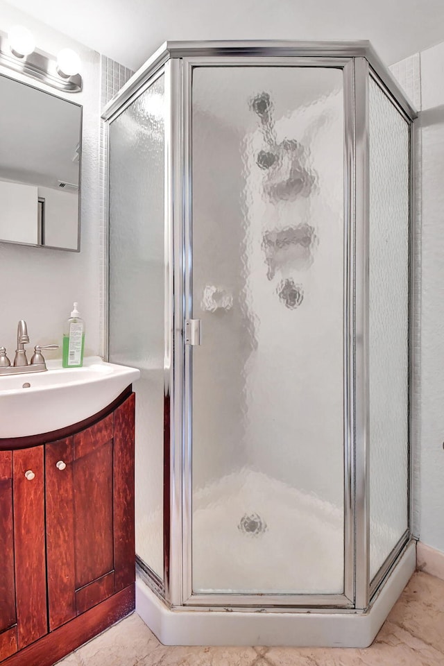 bathroom featuring vanity and walk in shower