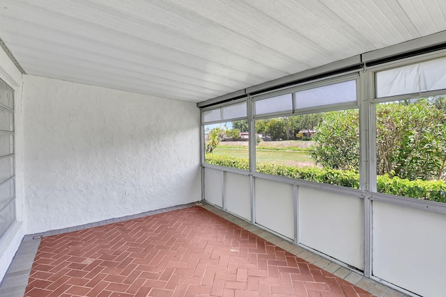 unfurnished sunroom featuring plenty of natural light