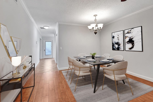 dining area featuring crown molding, wood-type flooring, and a textured ceiling