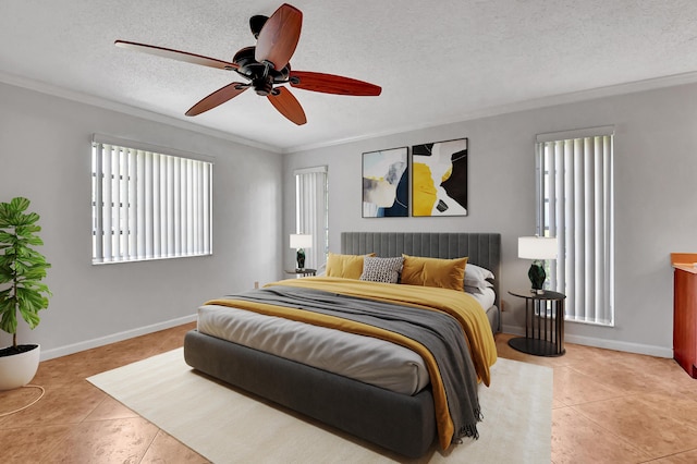 tiled bedroom featuring ceiling fan, ornamental molding, a textured ceiling, and multiple windows