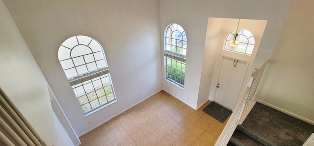 unfurnished bedroom featuring two closets, ensuite bathroom, and light colored carpet