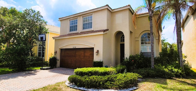 mediterranean / spanish-style house featuring a garage