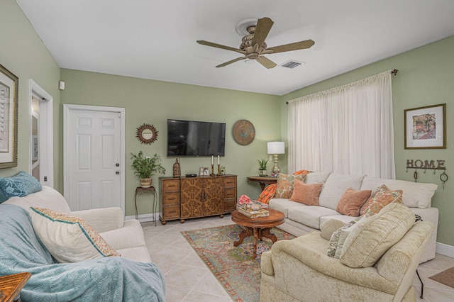 living room featuring ceiling fan and light tile patterned floors