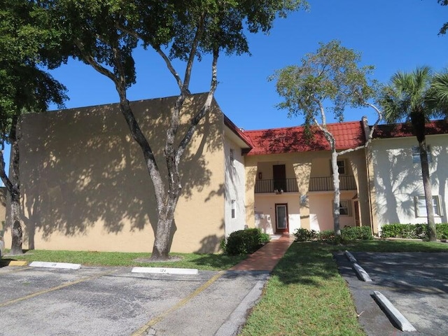 view of front of home with a balcony