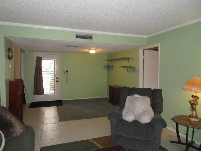 living room with a textured ceiling, tile flooring, and crown molding