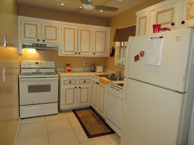 kitchen featuring white appliances, sink, light tile flooring, and ceiling fan