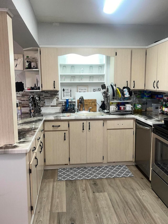 kitchen featuring light brown cabinets, decorative backsplash, light hardwood / wood-style floors, and stainless steel appliances