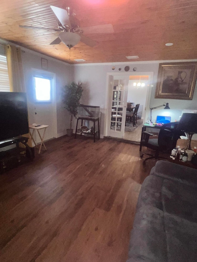 living room featuring dark wood-type flooring and ceiling fan