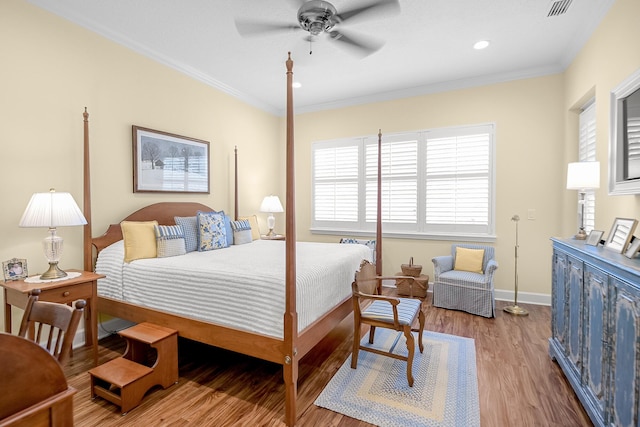 bedroom with ceiling fan, crown molding, and light wood-type flooring