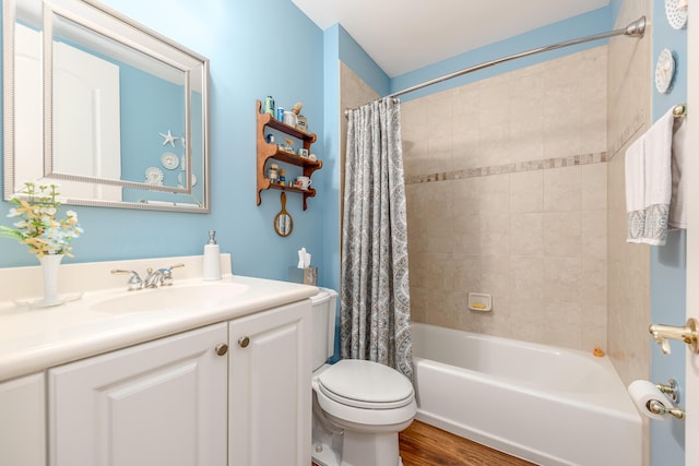 full bathroom featuring hardwood / wood-style flooring, vanity, toilet, and shower / bathtub combination with curtain