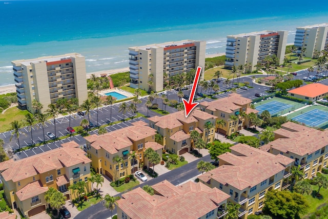 aerial view featuring a water view and a view of the beach