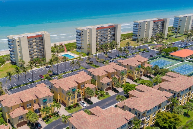 aerial view featuring a water view and a beach view