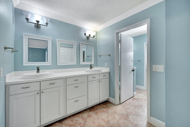 bathroom with vanity, ornamental molding, a textured ceiling, and tile patterned flooring