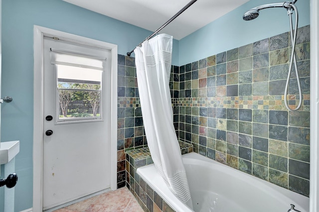 bathroom featuring shower / tub combo with curtain and tile patterned floors