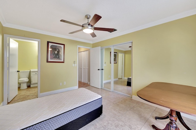 bedroom with ceiling fan, ornamental molding, ensuite bathroom, and light tile patterned floors