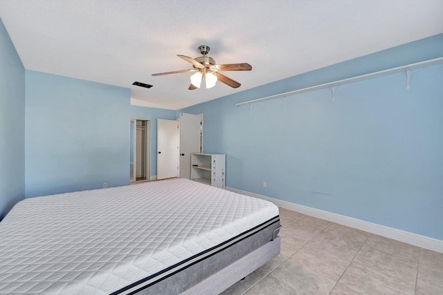 bedroom featuring light tile patterned flooring and ceiling fan