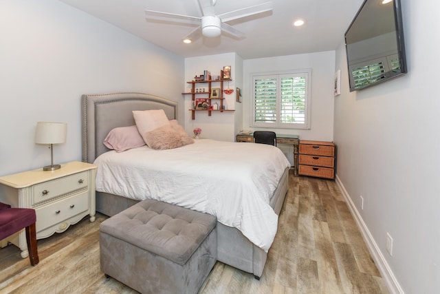 bedroom with ceiling fan and light hardwood / wood-style flooring