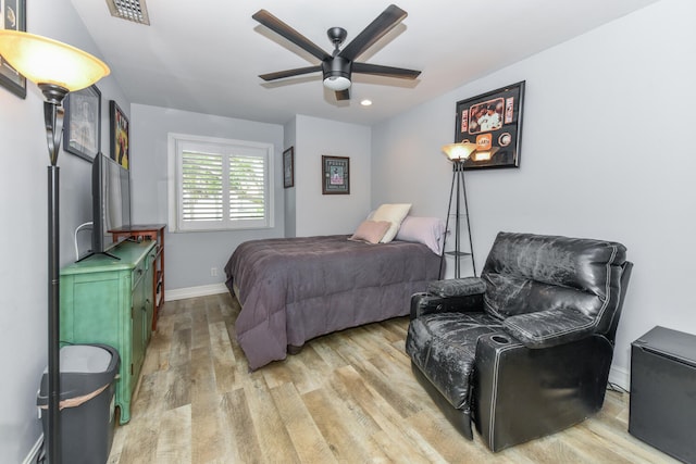 bedroom featuring light hardwood / wood-style flooring and ceiling fan