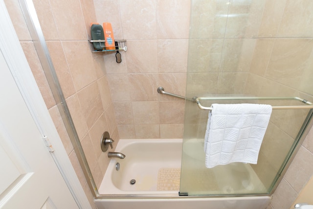 bathroom featuring enclosed tub / shower combo