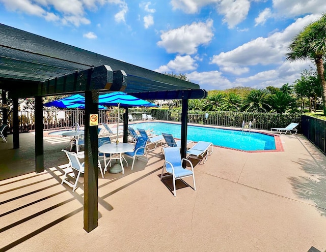 view of swimming pool with a pergola and a patio area