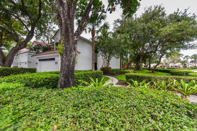 obstructed view of property featuring a garage