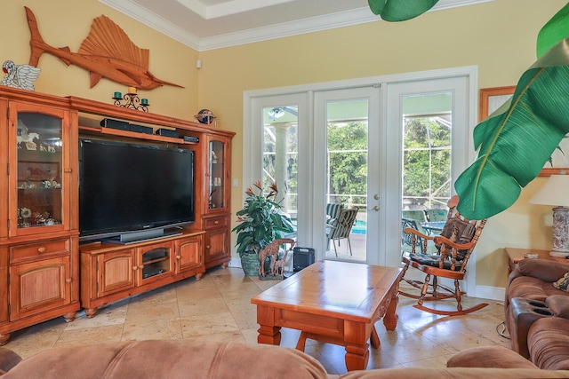 living room with ornamental molding and french doors