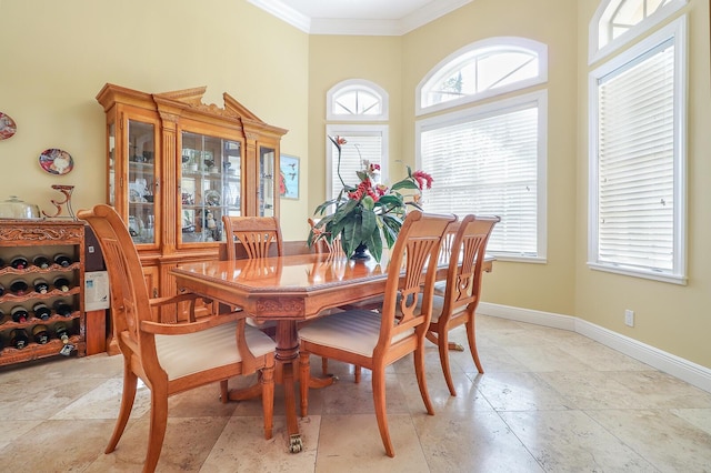 dining space featuring ornamental molding