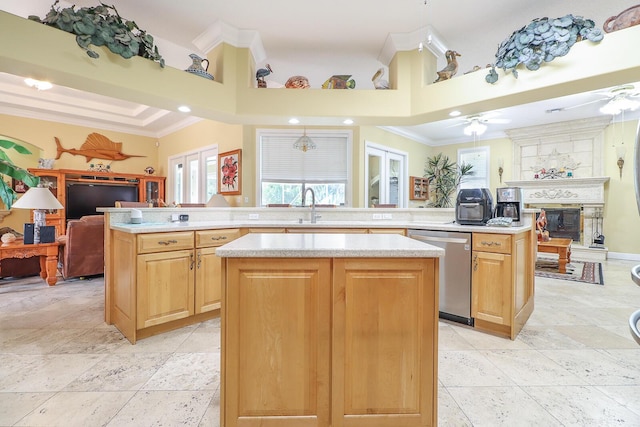 kitchen with kitchen peninsula, dishwasher, a center island, and ornamental molding